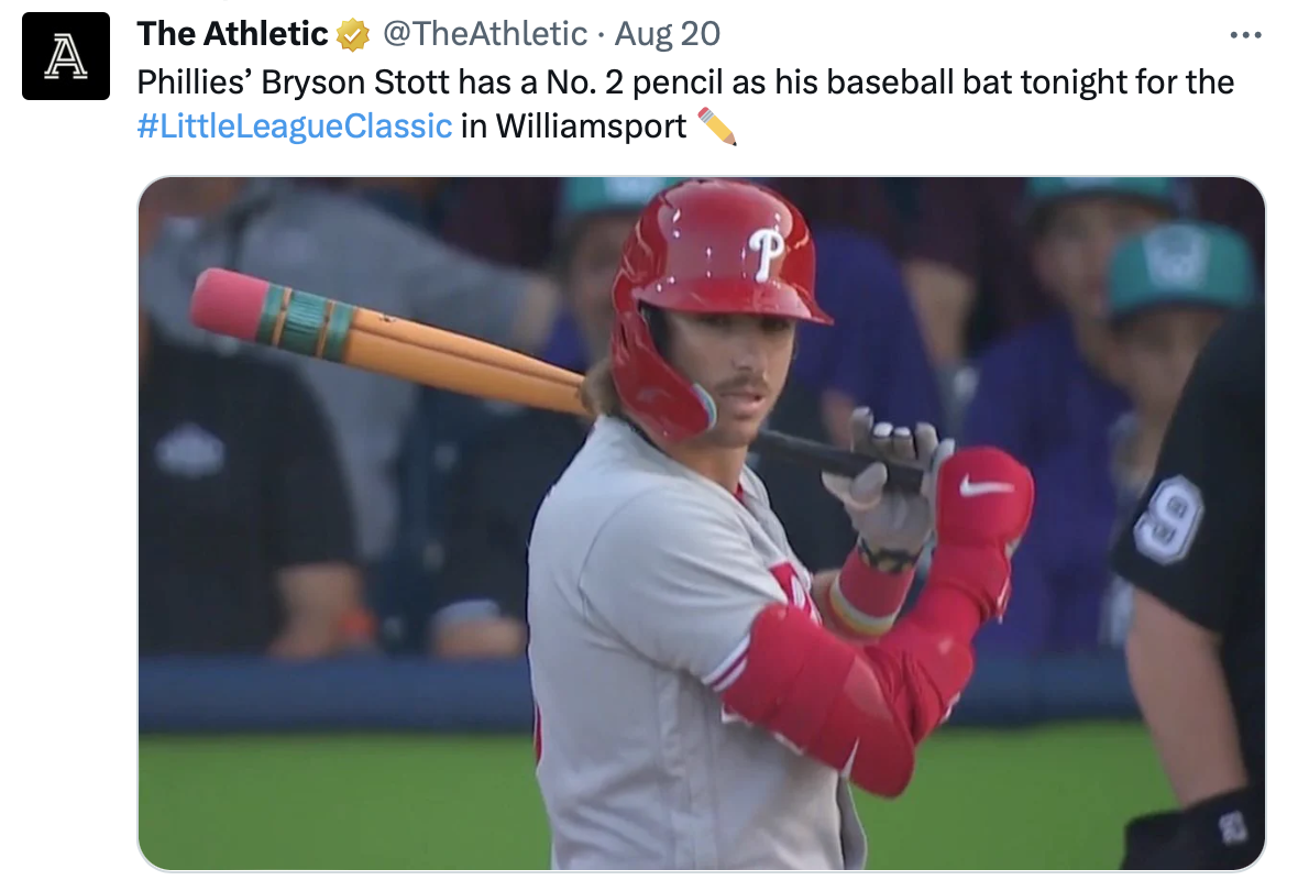 A screenshot of a tweet that shows the Philadelphia Phillies’ Bryson Stott using a bat decorated like a No. 2 pencil during the Little League Classic.